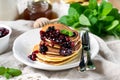 Homemade pancakes with berry sauce coulis and mint Royalty Free Stock Photo