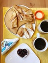 homemade pancakes with cottage cheese and coffee on a wooden table