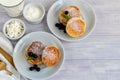 Homemade pancakes with cottage cheese on a white lantern with black currants and cranberries. Breakfast for the whole family. Royalty Free Stock Photo