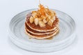 Homemade pancakes dessert with sliced banana, maple syrup drops and sugar powder Royalty Free Stock Photo