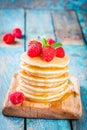 Homemade pancakes with honey and raspberry Royalty Free Stock Photo