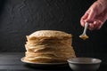 Homemade pancakes with honey and walnuts, vintage white plate, d