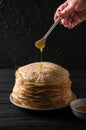 Homemade pancakes with honey and walnuts, vintage white plate, d