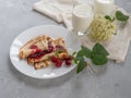 Homemade pancakes with raspberry jam, natural milk.