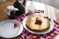 Homemade pancakes with sour cream and fresh berries