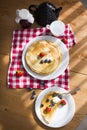 Homemade pancakes with sour cream and fresh berries