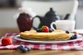 Homemade pancakes with sour cream and fresh berries