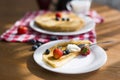 Homemade pancakes with sour cream and fresh berries