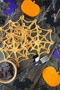 Homemade pancakes spider web with spiders for Halloween. Scary halloween. View from above. Close-up