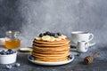 Homemade pancakes with syrup and berries. Morning and breakfast: pancakes with banana and blueberries Royalty Free Stock Photo