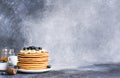 Homemade pancakes with syrup and berries. Morning and breakfast: pancakes with banana and blueberries Royalty Free Stock Photo