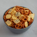 Homemade Party Snack Mix with Crackers and Pretzels in a Bowl, side view. Close-up Royalty Free Stock Photo