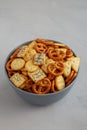 Homemade Party Snack Mix with Crackers and Pretzels in a Bowl, side view. Close-up Royalty Free Stock Photo