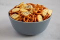 Homemade Party Snack Mix with Crackers and Pretzels in a Bowl, side view. Close-up Royalty Free Stock Photo