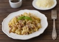 Homemade Pasta carbonara Italian with Bacon, eggs, Parmesan Cheese on white plate on a dark background. Royalty Free Stock Photo