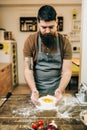 Pasta cooking, bearded chef preparing dough Royalty Free Stock Photo