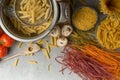 Homemade pasta cooking in a pot of water and cooking ingredients with a cutting board, top view. The concept of Italian cuisine an Royalty Free Stock Photo