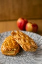Homemade pastries freshly baked puff pastry puffs with apples on a plate close-up Royalty Free Stock Photo