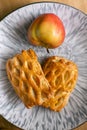 Homemade pastries freshly baked puff pastry puffs with apples on a plate close-up Royalty Free Stock Photo