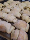 Homemade pastry. The rugelach with jam in a grass container. Homemade holiday cookie. Bagels. Croissants