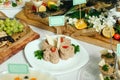 Homemade pate laid out on a white plate, with a slice of loaf.