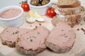 Homemade pate, olives, tomatoes and slices of bread on wooden board Royalty Free Stock Photo