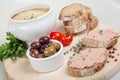 Homemade pate, tomatoes and slices of bread on wooden board Royalty Free Stock Photo