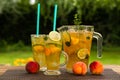 Homemade peach ice tea with lime and lemon balm Royalty Free Stock Photo