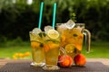 Homemade peach ice tea with lime and lemon balm Royalty Free Stock Photo