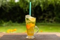 Homemade peach ice tea with lime and lemon balm Royalty Free Stock Photo