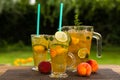 Homemade peach ice tea with lime and lemon balm Royalty Free Stock Photo