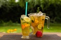 Homemade peach ice tea with lime and lemon balm Royalty Free Stock Photo