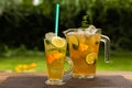 Homemade peach ice tea with lime and lemon balm Royalty Free Stock Photo