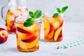 Homemade peach iced tea or lemonade with fresh mint and ice cubes in glass jar Royalty Free Stock Photo