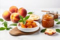 Homemade peach jam in glass jar on white background with fresh peaches and text space Royalty Free Stock Photo