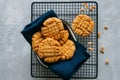 Homemade peanut butter cookies on a wire rack. Gray background. Royalty Free Stock Photo