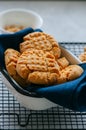 Homemade peanut butter cookies on a wire rack. Gray background. Royalty Free Stock Photo