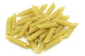 Homemade penne pasta heap on white isolated background in macro top view. Penne look like tube and have yellow color. Pasta is Royalty Free Stock Photo