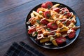 Homemade Peruvian Salchipapa Fries with Sausage Slices, Ketchup and Mayonnaise. Royalty Free Stock Photo