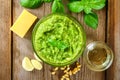 Homemade pesto sauce. Ingredients. Cheese, garlic, basil, pine nuts, olive oil on an old wooden table. Royalty Free Stock Photo