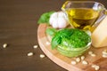Homemade pesto sauce with ingredients over old table. Royalty Free Stock Photo