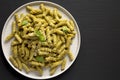 Homemade Pesto Twist Pasta on a plate on a black background, top view. Overhead, from above, flat lay. Copy space Royalty Free Stock Photo