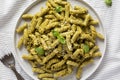 Homemade Pesto Twist Pasta on a plate on cloth, top view. Overhead, from above Royalty Free Stock Photo