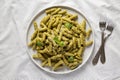 Homemade Pesto Twist Pasta on a plate, top view. Overhead, from above, flat lay Royalty Free Stock Photo