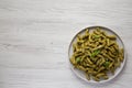 Homemade Pesto Twist Pasta on a plate on a white wooden background, overhead view. Top view, from above, flat lay. Copy space Royalty Free Stock Photo