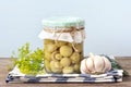 Homemade pickled cherry tomatoes, cucumbers, champignons, garlic, eggplant, red peppers in jars on wooden shelf Homemade canned Royalty Free Stock Photo