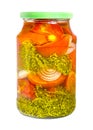 Homemade pickled tomatoes in glass jar.