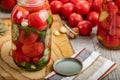 Homemade pickled tomatoes in jar. Selective focus.