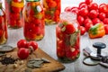 Homemade pickled tomatoes in jar. Selective focus.