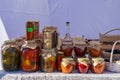 Homemade pickles in jars on the counter of the city fair. November 11, 2021 Balti Moldova